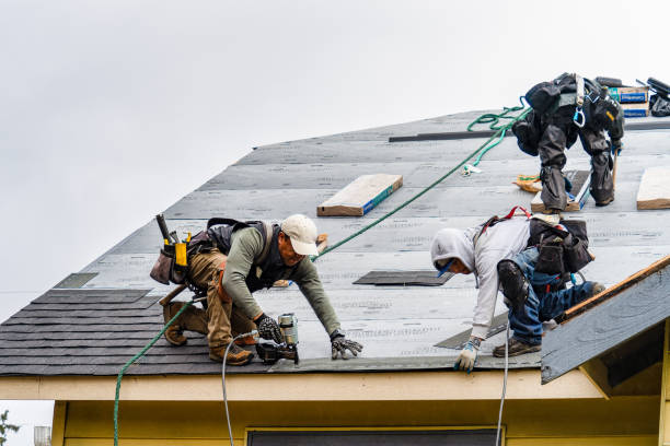 Professional Gutter Installation technician working in Cosmopolis, WA